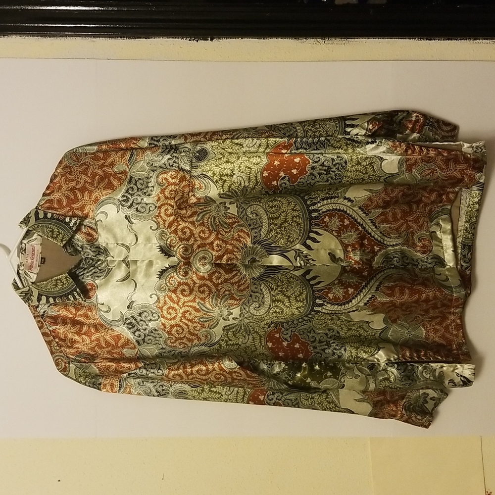 Long-sleeved Silk blouse with floral pattern.
